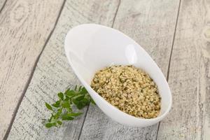 Peeled hemp seeds in the bowl photo