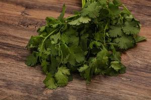 Green coriander or cilanto leaves heap photo