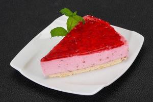 Soft Raspberry cheesecake served mint photo