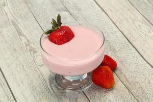 Yoghurt with strawberry in the bowl photo