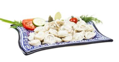 Bowl with traditional russian dish - pelmeni photo