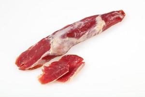 Smoked pork meat over white background photo