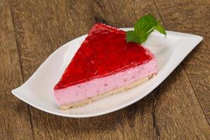 Soft Raspberry cheesecake served mint photo