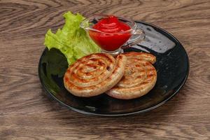 Grilled round pork tasty sausages photo