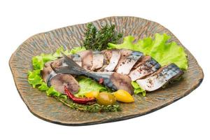 Mackerel fish, sliced on a plate with lettuce photo