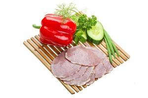 Ripe fresh ham with vegetables photo