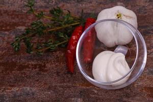 Mayonnaise sauce in the white bowl served thyme and garlic photo