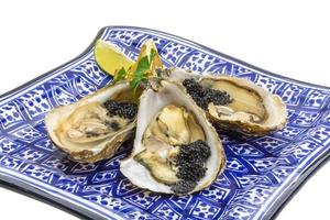 Oysters with black cavair photo