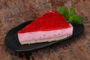 Soft Raspberry cheesecake served mint photo