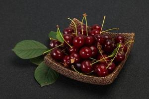 Sweet ripe cherry with leaves photo