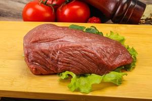 Raw beef cut for cooking photo