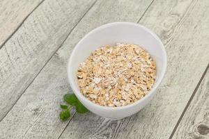 Raw oats in the bowl photo