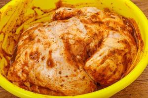 Raw marinated chicken for cooking photo