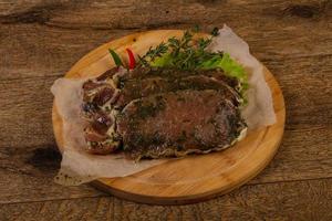 Raw marinated pork steak photo