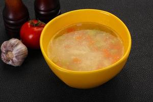 Chicken soup with noodles photo