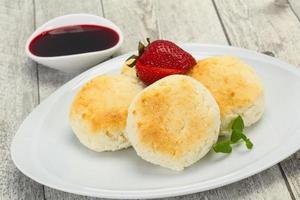 Curd pancakes with jam and stravberry photo