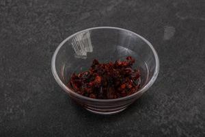 Fried chili pepper sauce with oil photo