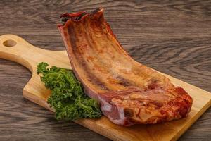 Smoked pork ribs with spices photo