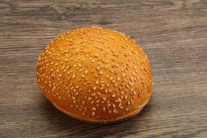 Burger bun with sesame seeds photo