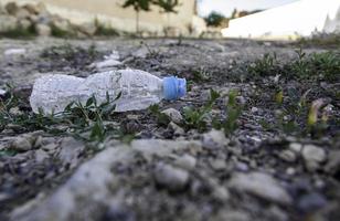 Plastic bottle in nature photo