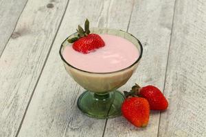 Yoghurt with strawberry in the bowl photo