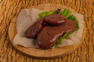 Raw pork kidneys photo