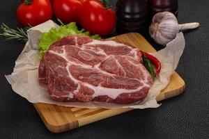 Raw pork neck steak photo