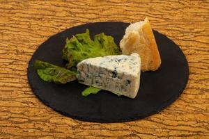 Blue cheese  with salad leaves photo