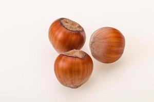 Hazelnut heap isolated over background photo