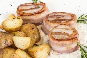 Grilled steak wrapped in bacon, with grilled vegetables, mashed potatoes photo
