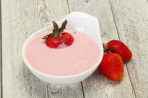 Yoghurt with strawberry in the bowl photo