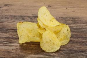 Natural potato salted chips heap photo