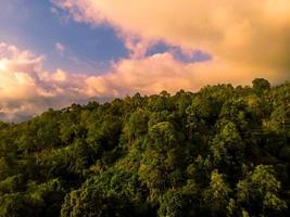 Mountain forest aerial shot with clouds photo