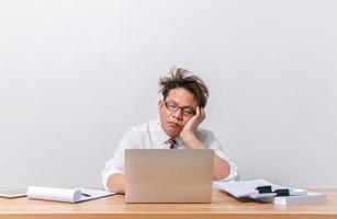 Asian business man sitting and working and stressed photo