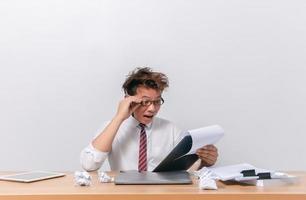 Asian business man sitting and working and stressed photo