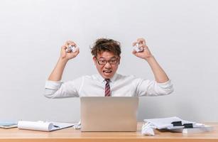 Asian business man sitting and working and stressed photo