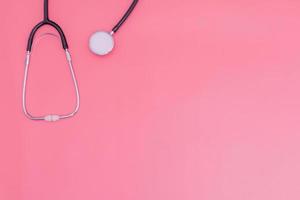 stethoscope on pink background and copy space photo