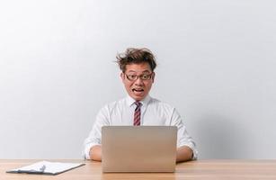 Asian business man sitting and working and stressed photo