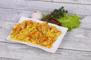 Traditional Pilaf with chicken and carrot photo