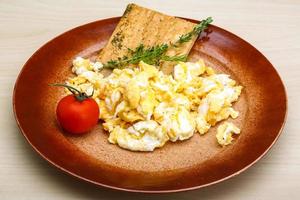 Scrambled eggs with tomato photo