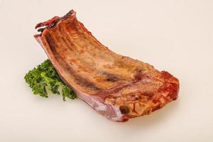 Smoked pork ribs with spices photo