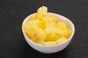 Marinated pineapple pieces photo