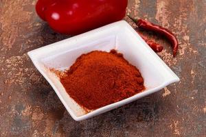 Paprika powder in the bowl photo