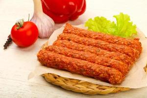 Raw beef sausages photo