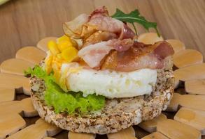 Crispy sandwich with egg and bacon photo