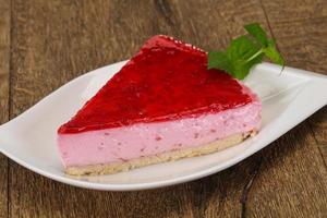 Soft Raspberry cheesecake served mint photo