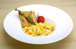 Scrambled eggs with tomato photo