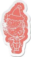 cartoon distressed sticker of a squinting girl wearing santa hat vector