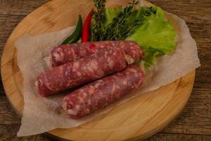 Raw pork sausages photo