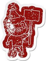 cartoon distressed sticker of a bearded protester crying wearing santa hat vector